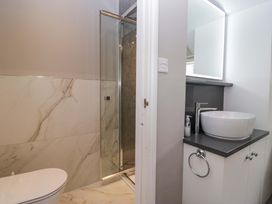 A bathroom with a shower and sink at Beckmead in Windermere