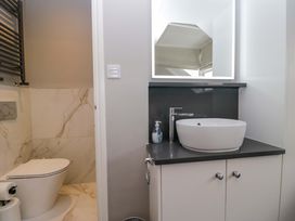 A bathroom with a sink and a toilet at Beckmead in Windermere