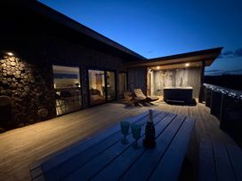 An outdoor area with a deck and hot tub at Bryn Hafod in Llandrindod Wells