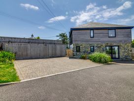 An outdoor area with a house and driveway at Sandy Cove, Praa Sands