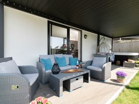 An outdoor seating area with furniture at Sandy Cove in Praa Sands