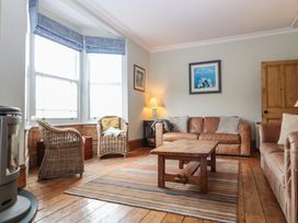 A living room with a sofa and coffee table at Kipper Lodge in Dartmouth
