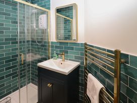 A bathroom with a shower and sink at Kipper Lodge Dartmouth