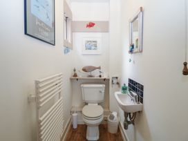 A bathroom with a toilet and sink at Kipper Lodge in Dartmouth