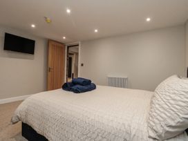 A bedroom with a bed and towels on it at Betsy's Burrow