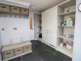 A mudroom with storage bench and shelves at Valley Pines in Valley