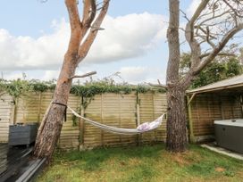 A garden with a hammock between two trees at Valley Pines in Valley