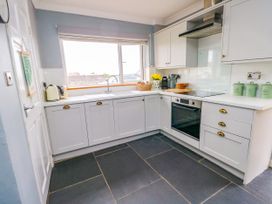 A kitchen with cabinets and a sink at Valley Pines in Valley
