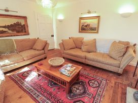 A living room with sofas and a coffee table at Garsdale Foot in Sedbergh