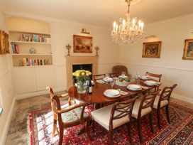 A dining room with a table set for dinner at Garsdale Foot in Sedbergh