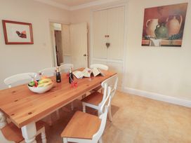 A dining room with a table and chairs at Garsdale Foot in Sedbergh