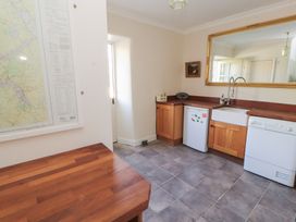 A kitchen with a map on the wall and appliances at Garsdale Foot Sedbergh