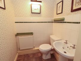 A bathroom with a toilet and sink at Garsdale Foot in Sedbergh