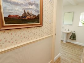 A bathroom with a sink and a mirror at Garsdale Foot in Sedbergh