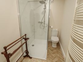 A bathroom with a shower and toilet at Garsdale Foot Sedbergh