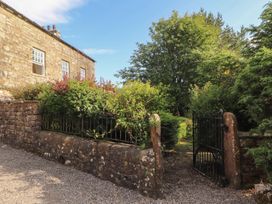A gated entrance with greenery at Garsdale Foot in Sedbergh