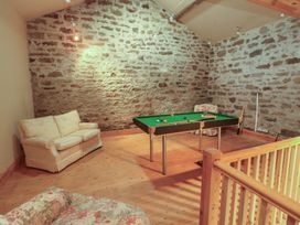 A snug with a pool table and sofas at Garsdale Foot in Sedbergh