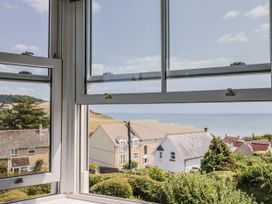 A view of the sea and houses from a window at St Helena in Charmouth