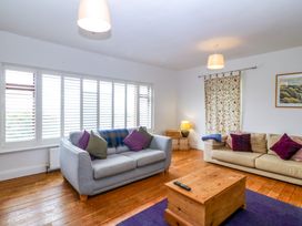 A living room with sofa and coffee table at Faraway in Rhosneigr
