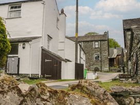 A street view of houses and a road at Woodloft Cottage Elterwater near Chapel Stile