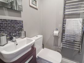 A bathroom with a sink and toilet at Holly Lodge in Aldeburgh