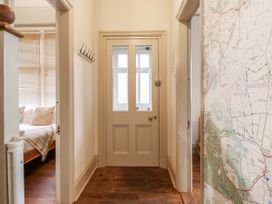 A hallway with a map on the wall at Holly Lodge in Aldeburgh