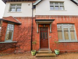 A front entrance with a door and windows at Holly Lodge in Aldeburgh