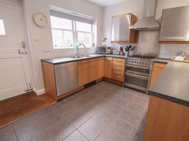 A kitchen with a sink and oven at Lavender House, Aldeburgh