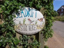 A sign with the text Seadrift Stay Here and illustrations of birds at Seadrift Dunwich Near Westleton