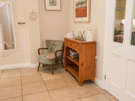 A chair and a console table in the hallway at Seadrift in Dunwich Near Westleton