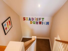A stairway with decorative letters at Seadrift in Dunwich Near Westleton