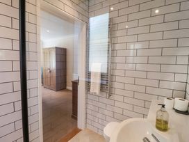 A bathroom with a shower and sink at Seadrift Dunwich Near Westleton