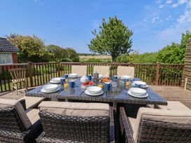 An outdoor dining area with a table set for breakfast at Seadrift Dunwich Near Westleton