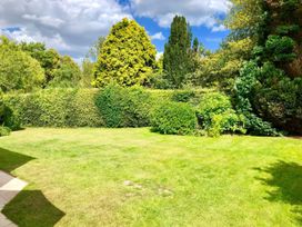 A garden with grass and trees at Rippleway, Walberswick
