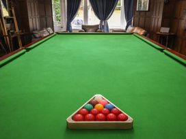 A pool table with billiard balls arranged at Henstead Hall, Henstead near Beccles