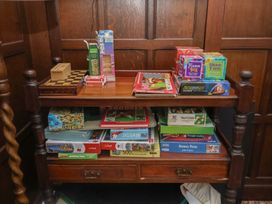A table with various board games and puzzles at Henstead Hall in Henstead near Beccles