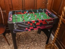 A foosball table in a game room at Henstead Hall Henstead near Beccles