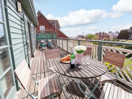 An outdoor terrace with a table and chairs at Robert Sadler's Studio Aldeburgh