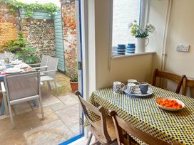 A dining room with a table and chairs at Seaflower, Aldeburgh