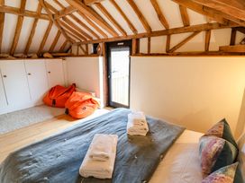 A bedroom with a bed and bean bags at Fishpond House, Sotherton