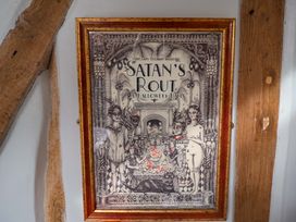 A framed illustration featuring Halloween-themed art at Fishpond House, Sotherton Halesworth