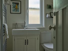 A bathroom with a sink and toilet at Harbour Lights Southwold