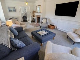 A living room with a coffee table and sofa at High Ground, Reydon