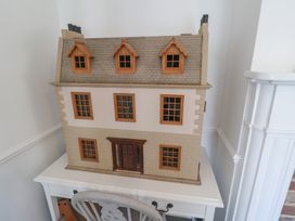 A dollhouse displayed on a table at High Ground, Reydon