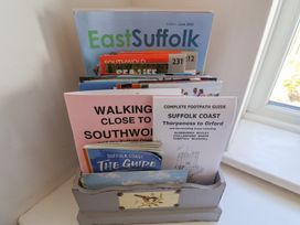 A collection of brochures and guides in a holder at High Ground, Reydon