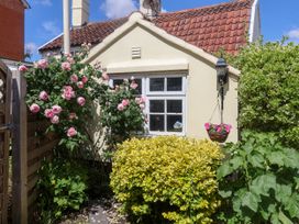 A cottage exterior with flowering plants at Cherry Tree Cottage, Woodbridge