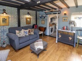 A living room with a sofa and coffee table at Cherry Tree Cottage, Woodbridge