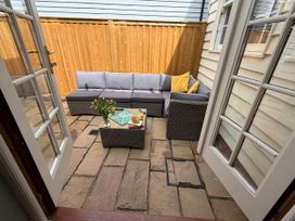 An outdoor area with a sofa and table at 11 Crabbe Street, Aldeburgh