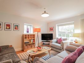 A living room with a sofa and coffee table at Fig Cottage, Pettistree Near Woodbridge