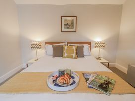 A bedroom with a bed and coffee on a tray at Fig Cottage, Pettistree Near Woodbridge